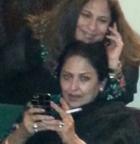 Anju Mahendru holding a cigarette in her hand