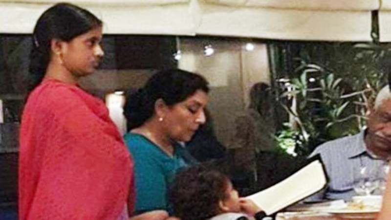 A picture of Renuka Chowdhury with a maid standing beside her