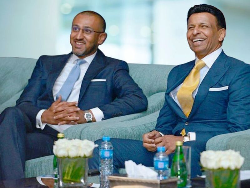 A photo of Sunny Varkey with his son Dino Varkey
