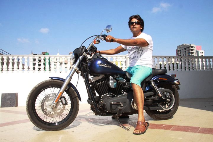 Ravi Kishan sitting on his Harley Davidson