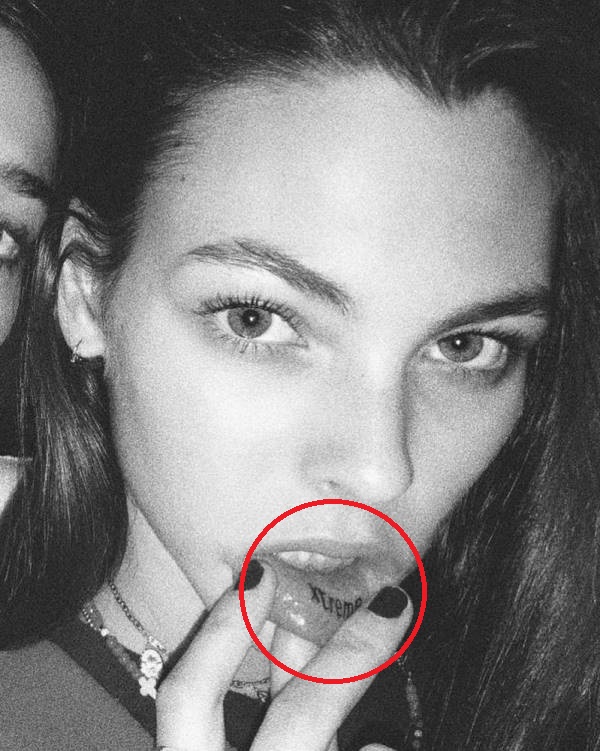 Vittoria Ceretti's 'Xtreme' tattoo inked inside her lower lip
