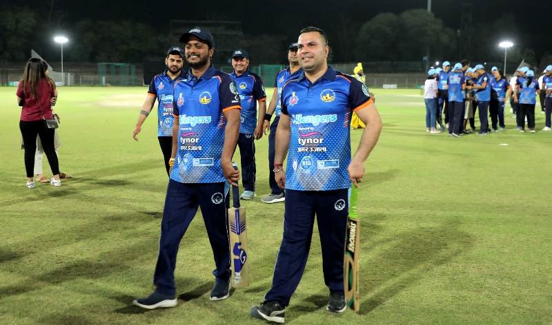 Manoj Sonkar (left) during a cricket tournament