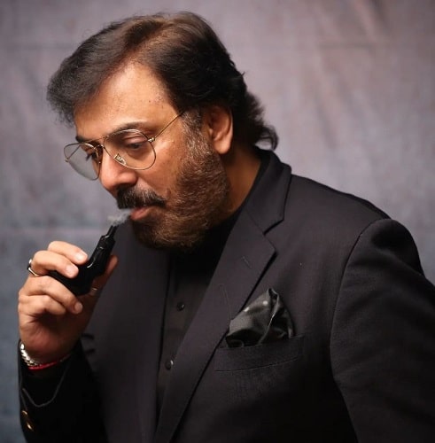 Nauman Ijaz smoking cigar
