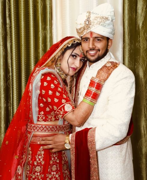 Nitesh Kumar and his wife at their wedding ceremony in 2022