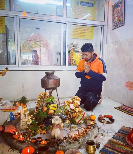 Nitesh Kumar praying at a temple