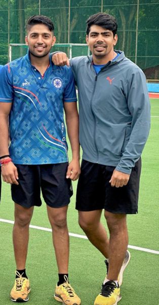 Nitesh Kumar with Pawan Sehrawat (right)